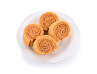 Jam cake roll on white ground.