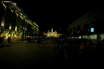 Fototapeta na wymiar City lit by lights at night
