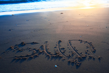 The inscription on the sand