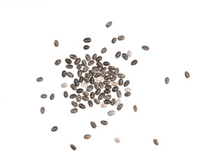 Healthy chia seeds spread out and isolated on white background