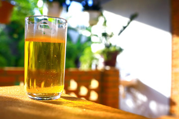 A glass of beer on a table