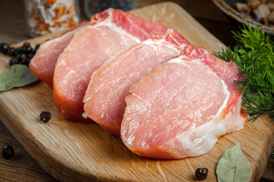 Slices of raw pork.