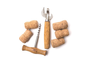 Vintage bottle opener, corkscrew and cork isolated on white background