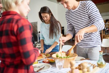 Friends preparing dinner together