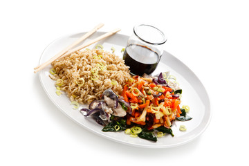Rice dish with goulash on white background 