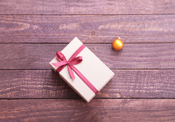 Gift boxes with bow on wood background