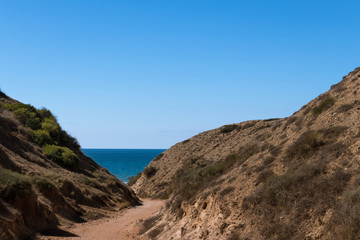 Valley path leading to the sea