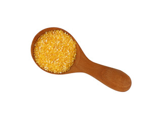 Polenta grits close up in wooden scoop on white