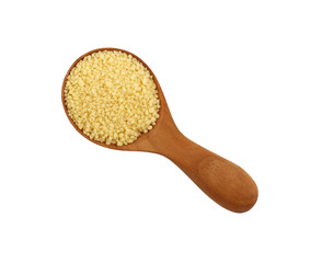 Couscous close up in wooden scoop on white