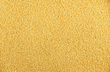 Couscous grain close up background