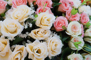   Beautiful roses of pink and beige fabric. Artificial flower made from fabric.