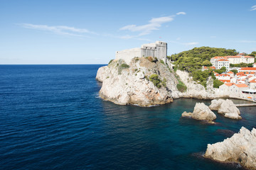 Fototapeta na wymiar Beautiful fortress Lovrijenac on the rocky coast and the Adriatic Sea. Dubrovnik, Croatia