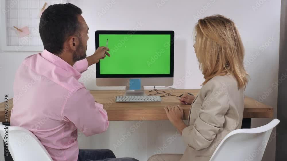 Poster business people sitting at the desk in front of computer with green screen have conversation. meetin