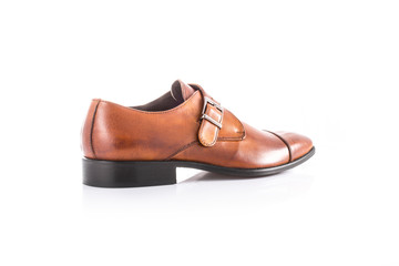 Close up of a brown men's monk shoes on white background with reflection