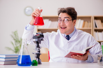 Mad crazy scientist doctor doing experiments in a laboratory