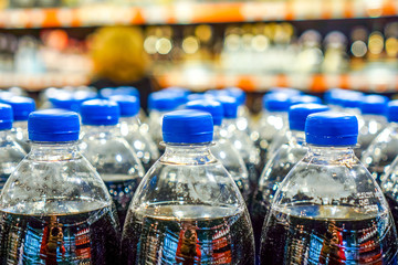 Many bottles with pepsi top view. background made by big pepsi bottles