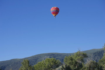 Hot Air Balloon Over Mountains
