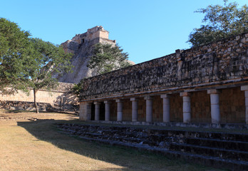 Fototapeta na wymiar View on the Ball court and Pyramid of the Magician, Uxmal, Mexico 