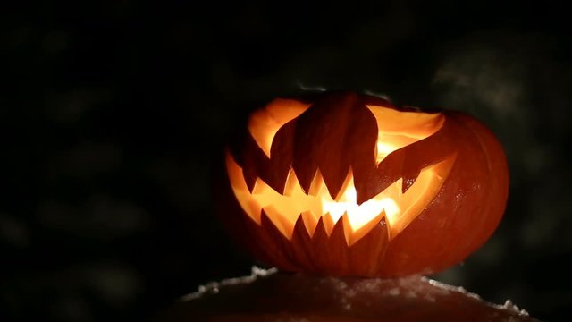 Burning pumpkin on Halloween. Looped