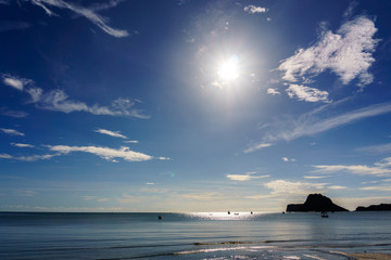 Fototapeta premium beautiful dramatic beach and seascape and skyline with blue sky and fluffy cloud and mountain on the island in the sea with sunshine in the morning. holiday, travel, tourism concept