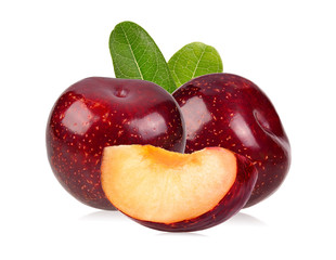 red cherry plum with green leaves isolated on white background