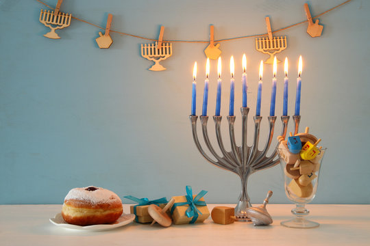 image of jewish holiday Hanukkah background with traditional spinnig top, menorah (traditional candelabra)