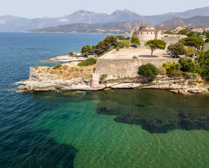 Fototapeta na wymiar Vista aerea del paese di Saint Florent, Corsica. Francia. Porto barche e case