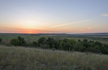 Fototapeta na wymiar Beautiful sunrise on the hill in August.