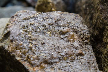 Raw mineral piece of ore quartz and pyrite gold nugget