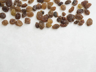 Organic dried raisins isolated on white grey background
