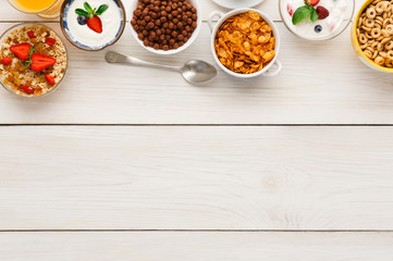 Healthy breakfast meals on wooden table copy space