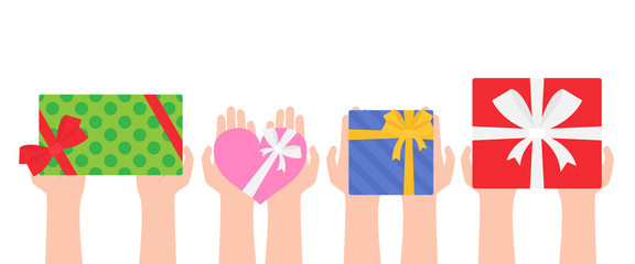 human hands holding gift boxes on white background top view