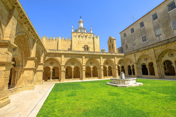 Fototapeta na wymiar Gothic romanesque cloister of old Coimbra Cathedral and dome. Se Velha de Coimbra, is one of most important romanesque buildings in Portugal and landmark in Coimbra, north of Portugal.