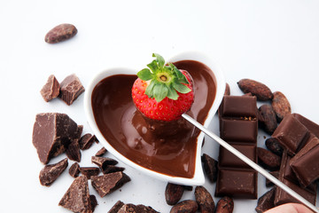 Fondue with Melting chocolate or melted chocolate and strawberry.