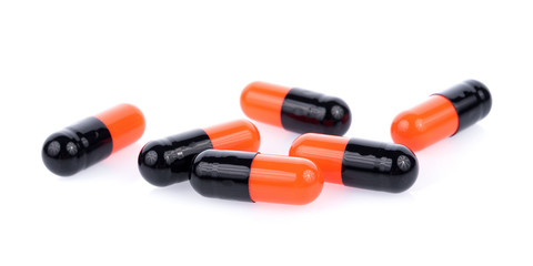 pills capsules isolated on white spoon