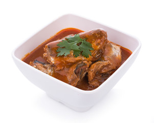 Sardines in tomato sauce on white bowl