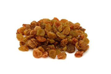 handful of dried raisins on a white background