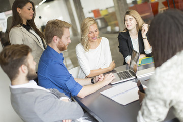 Multiracial businesspeople having meeting in conference room.