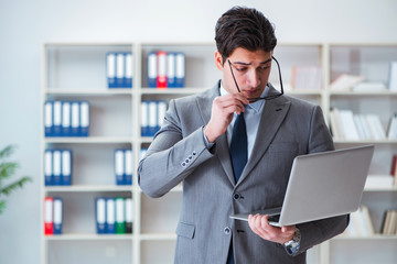 Businessman in the office working with laptop