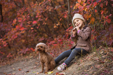 Little girl enjoying autumn day