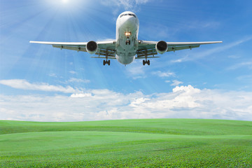 Blank billboard for your advertisement with space for text on green grass field,blue sky white cloud background.