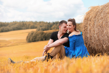 Naklejka na ściany i meble Couple on a walk in the country fields
