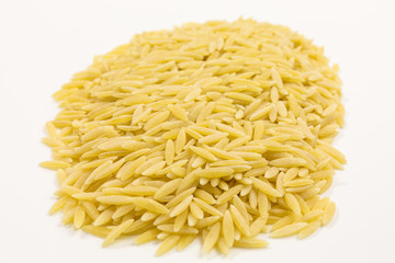 heap of uncooked greek kritharaki pasta