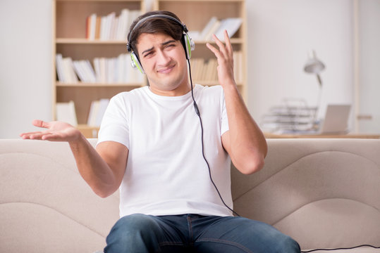 Man Listening To Music At Home