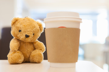 Coffee cup, blurred on teddy bear face