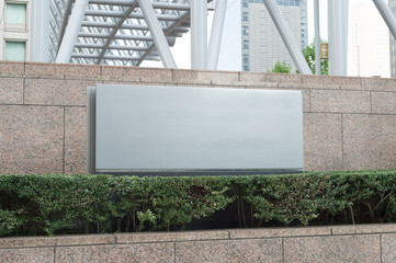 Large blank billboard on a street wall, banners with room to add your own text