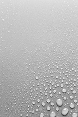 Water drops on grey surface, background