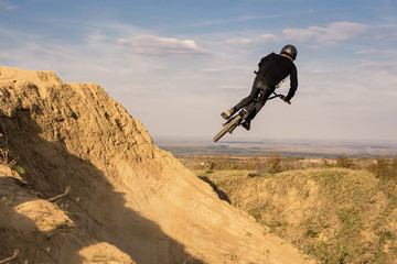 Man on mountain bike jump and fly from the trail © Drpixel