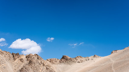 Fototapeta na wymiar Closeup image of mountains and blue sky background in Ladakh , India