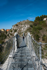 View on rope Tibetan steel bridge in mountain